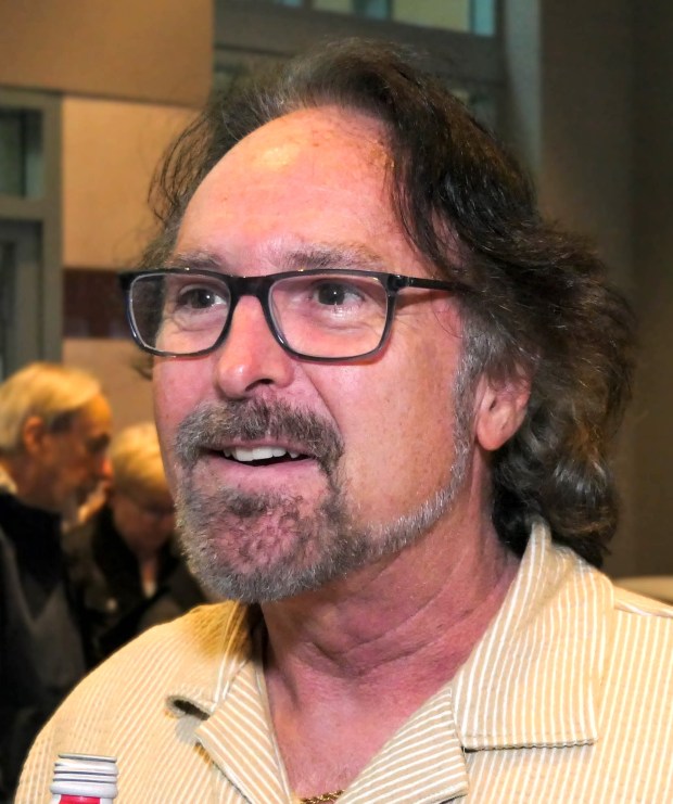 Duncan Black of Boca Raton speaks with Sun Sentinel reporter Ben Crandell before "Beatles vs. StonesA Musical Showdown" brought its British Invasion battle royale to the Marshall E. Rinker Sr. Playhouse at the Kravis Center for the Performing Arts in West Palm Beach on Wednesday, March 18, 2026. (Scott Luxor/Contributor)