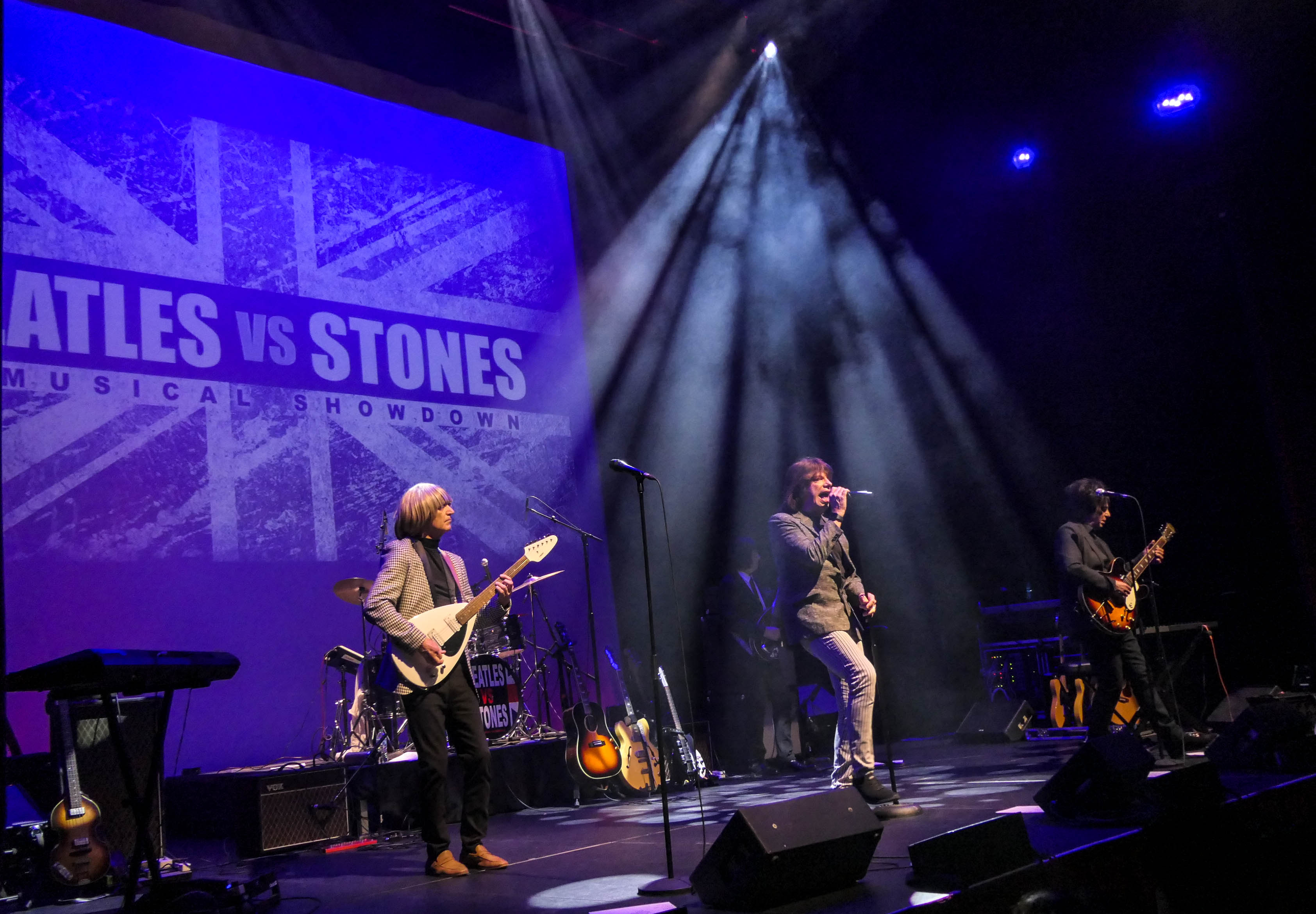 Satisfaction, portraying the Rolling Stones, performs during the 