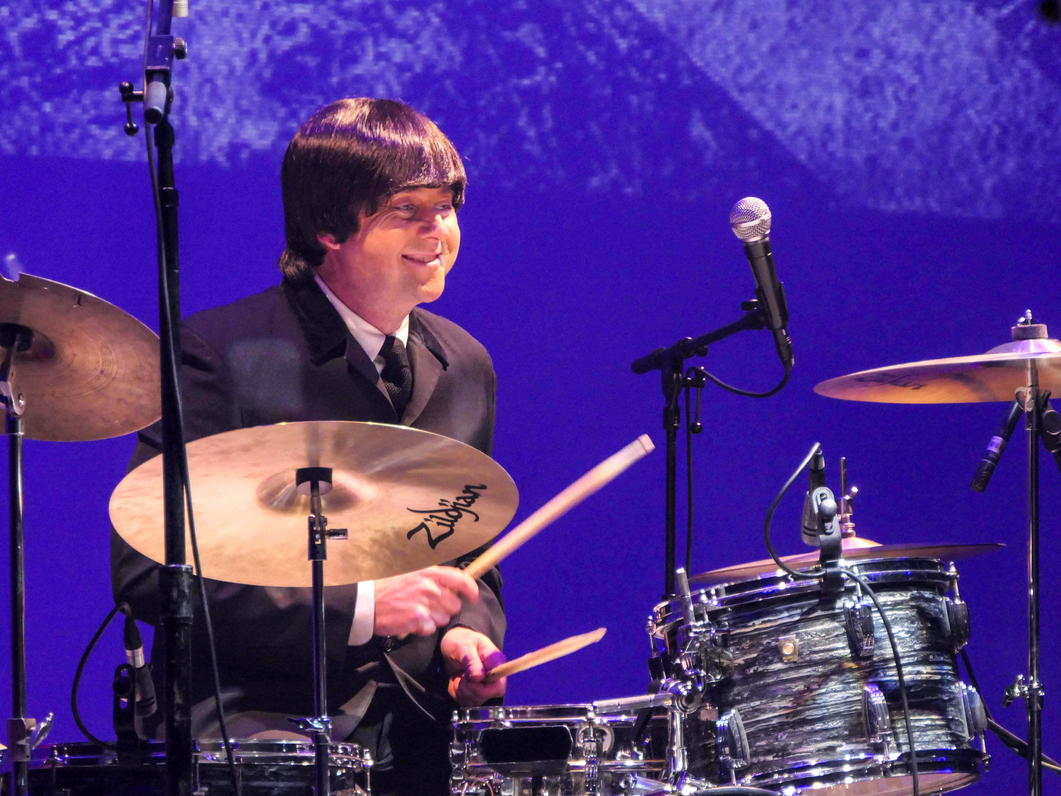 Abbey Road, portraying the Beatles, performs during the 