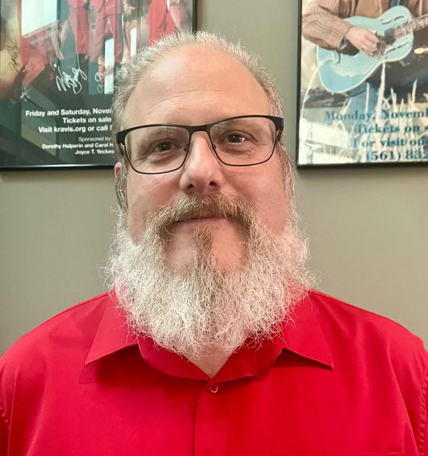 Chris Davenport of Greenacres speaks with Sun Sentinel reporter Ben Crandell before "Beatles vs. StonesA Musical Showdown" brought its British Invasion battle royale to the Marshall E. Rinker Sr. Playhouse at the Kravis Center for the Performing Arts in West Palm Beach on Wednesday, March 18, 2026. (Ben Crandell/South Florida Sun Sentinel)