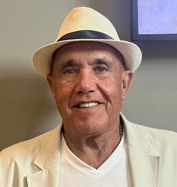 Leonardo Castino of Lighthouse Point speaks with Sun Sentinel reporter Ben Crandell before "Beatles vs. StonesA Musical Showdown" brought its British Invasion battle royale to the Marshall E. Rinker Sr. Playhouse at the Kravis Center for the Performing Arts in West Palm Beach on Wednesday, March 18, 2026. (Ben Crandell/South Florida Sun Sentinel)