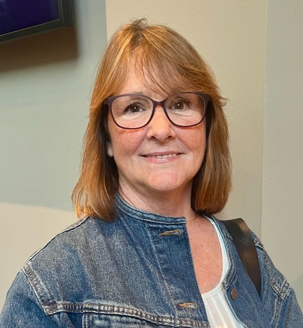 Colleen Apicella of Palm Beach Gardens speaks with Sun Sentinel reporter Ben Crandell before "Beatles vs. StonesA Musical Showdown" brought its British Invasion battle royale to the Marshall E. Rinker Sr. Playhouse at the Kravis Center for the Performing Arts in West Palm Beach on Wednesday, March 18, 2026. (Ben Crandell/South Florida Sun Sentinel)