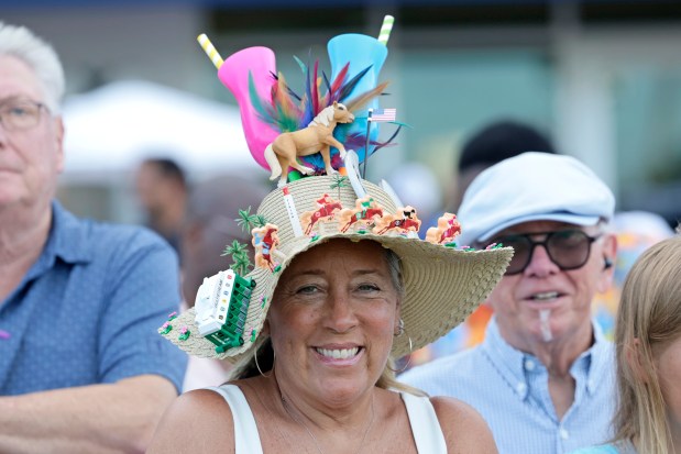 A fan watches a race during the Curlin Florida Derby at Gulfstream Park on Saturday, March 30, 2024 in Hallandale Beach. (John McCall/South Florida Sun Sentinel)