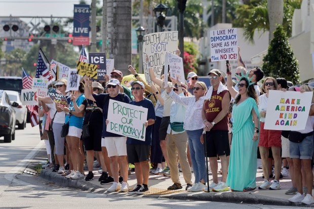 Protesters gather near Boca Raton City Hall on Saturday, March 28, 2026 for a No Kings protest. (Mike Stocker/South Florida Sun Sentinel)