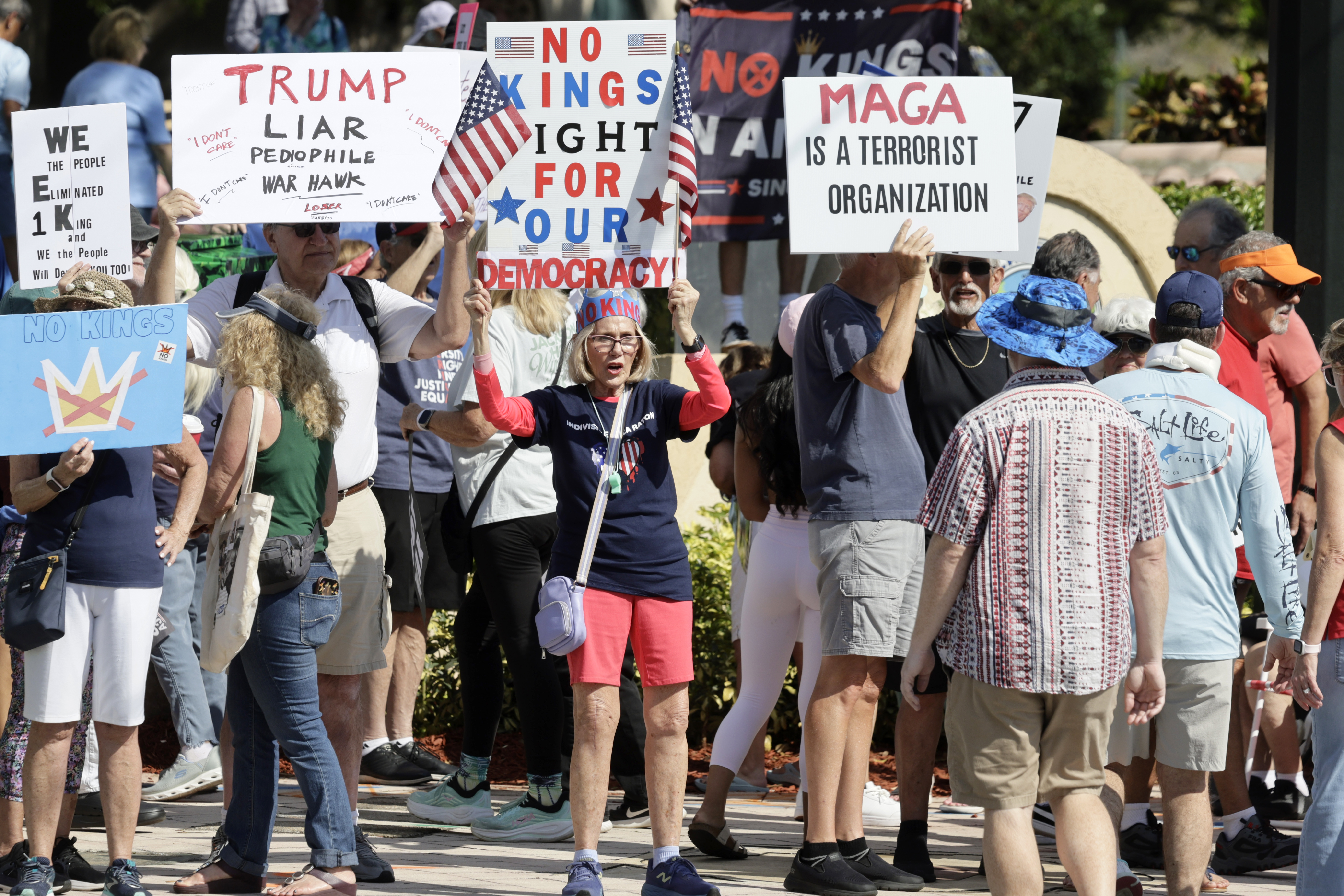 Protesters gather near Boca Raton City Hall on Saturday, March...