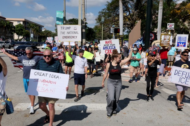 Protesters gather near Boca Raton City Hall on Saturday, March 28, 2026 for a "No Kings" protest. (Mike Stocker/South Florida Sun Sentinel)