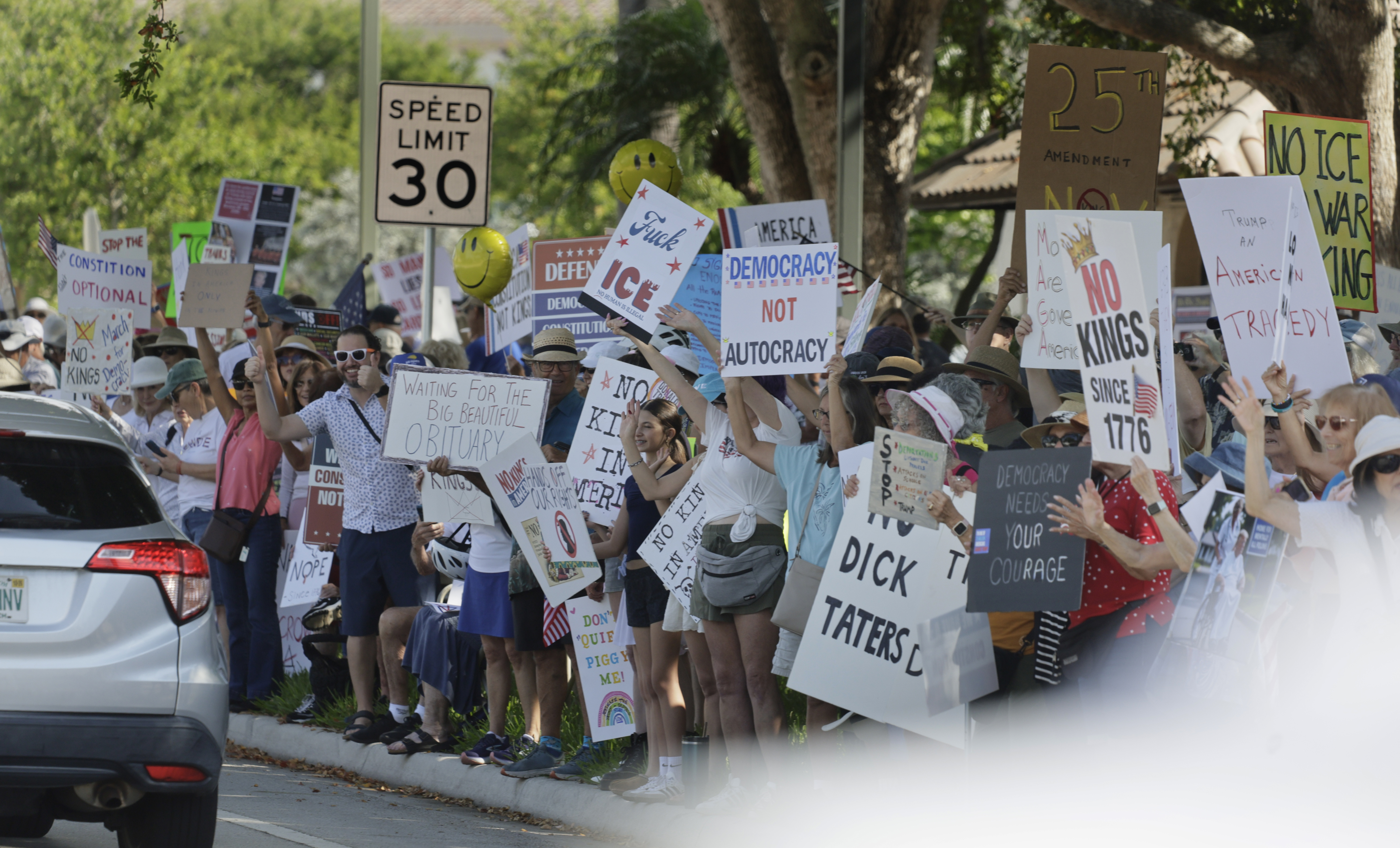 Protesters gather near Boca Raton City Hall on Saturday, March...
