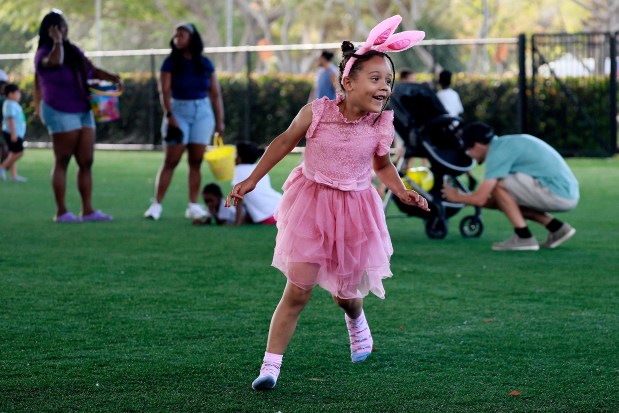 Brianna Dougherty, 5, runs and plays after the annual Springtime Egg Hunt, at the Margate Sports Complex on Saturday, April 19, 2025. (Mike Stocker/South Florida Sun Sentinel)