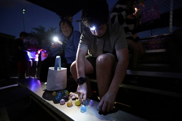 Chris Kampe sorts through his eggs after an egg hunt during Springfest at Robert P. Miller Park on Friday, March 29, 2024 in Delray Beach. (John McCall/South Florida Sun Sentinel)