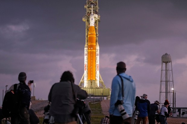 Photographers set up remote cameras near NASA's Artermis II moon rocket on Launch Pad 39-B just before sunrise at the Kennedy Space Center Tuesday, March 31, 2026, in Cape Canaveral, Fla. (Chris O'Meara/The Associated Press)