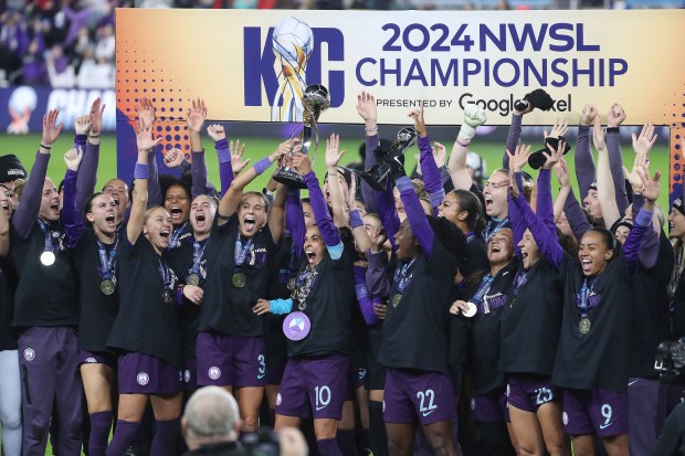 Orlando Pride players celebrate after winning the National Women's Soccer League championship match against the Washington Spirit in Kansas City, Missouri, on Saturday, Nov. 23, 2024. The Pride, sister team to MLS' Orlando City, began play in the 2016 season and brought Orlando its first major sports championship.. (Orlando Sentinel file)