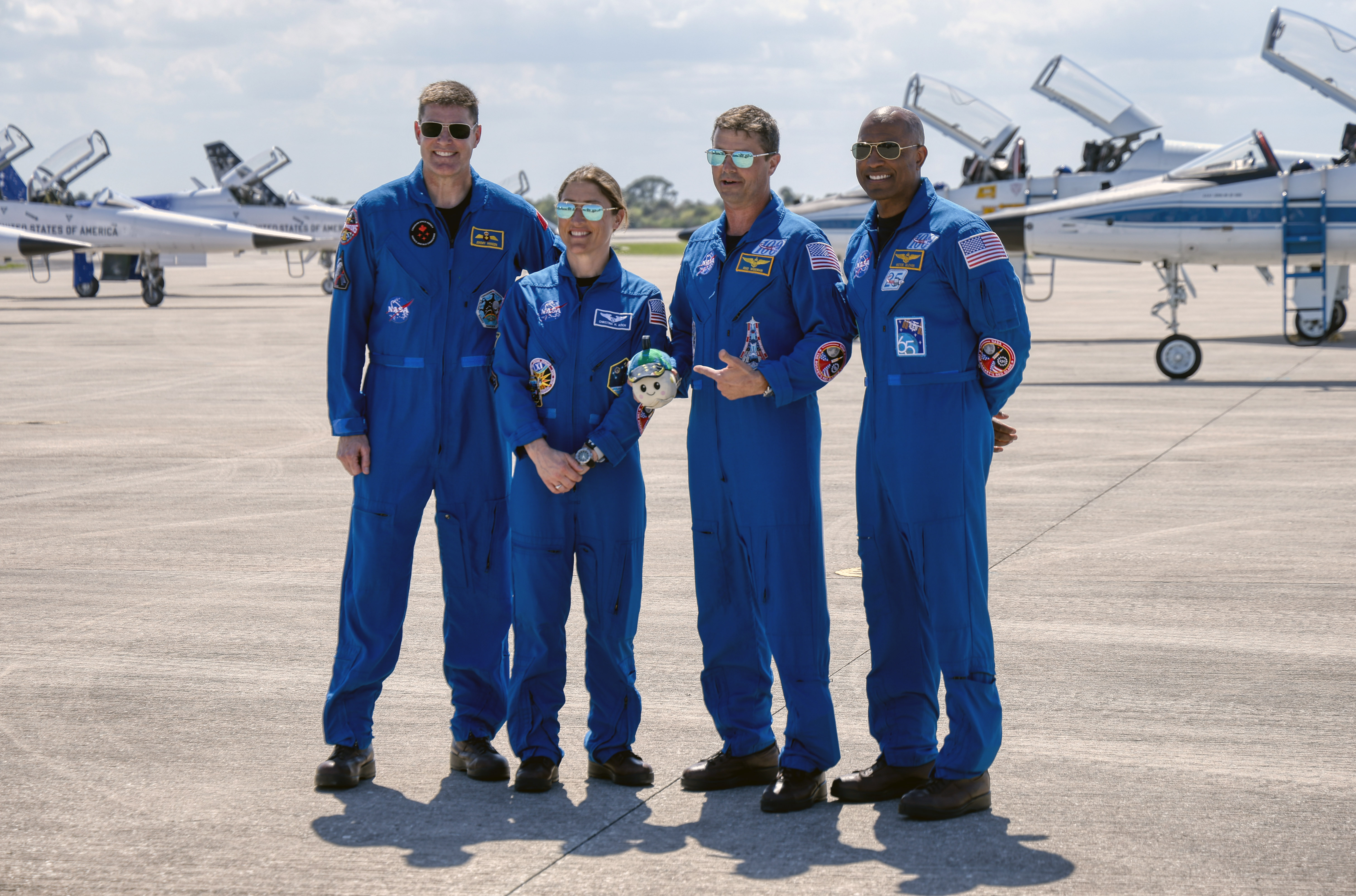 From left, Artemis II crew mission specialists Jeremy Hansen and...