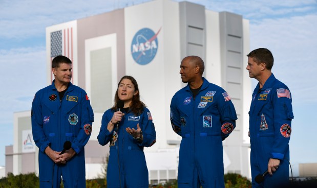 Left to Right, Artemis II crew: Jeremy Hansen, mission specialist, Canadian Space Agency; Christina Koch, mission specialist, NASA; Victor Glover, pilot, NASA; and Reid Wiseman, spacecraft commander, NASA; talk to the media, as the Artemis II rocket rolls out to Launch Complex 39-B at the Kennedy Space Center, on Saturday, January 17, 2026. (Ricardo Ramirez Buxeda/ Orlando Sentinel)