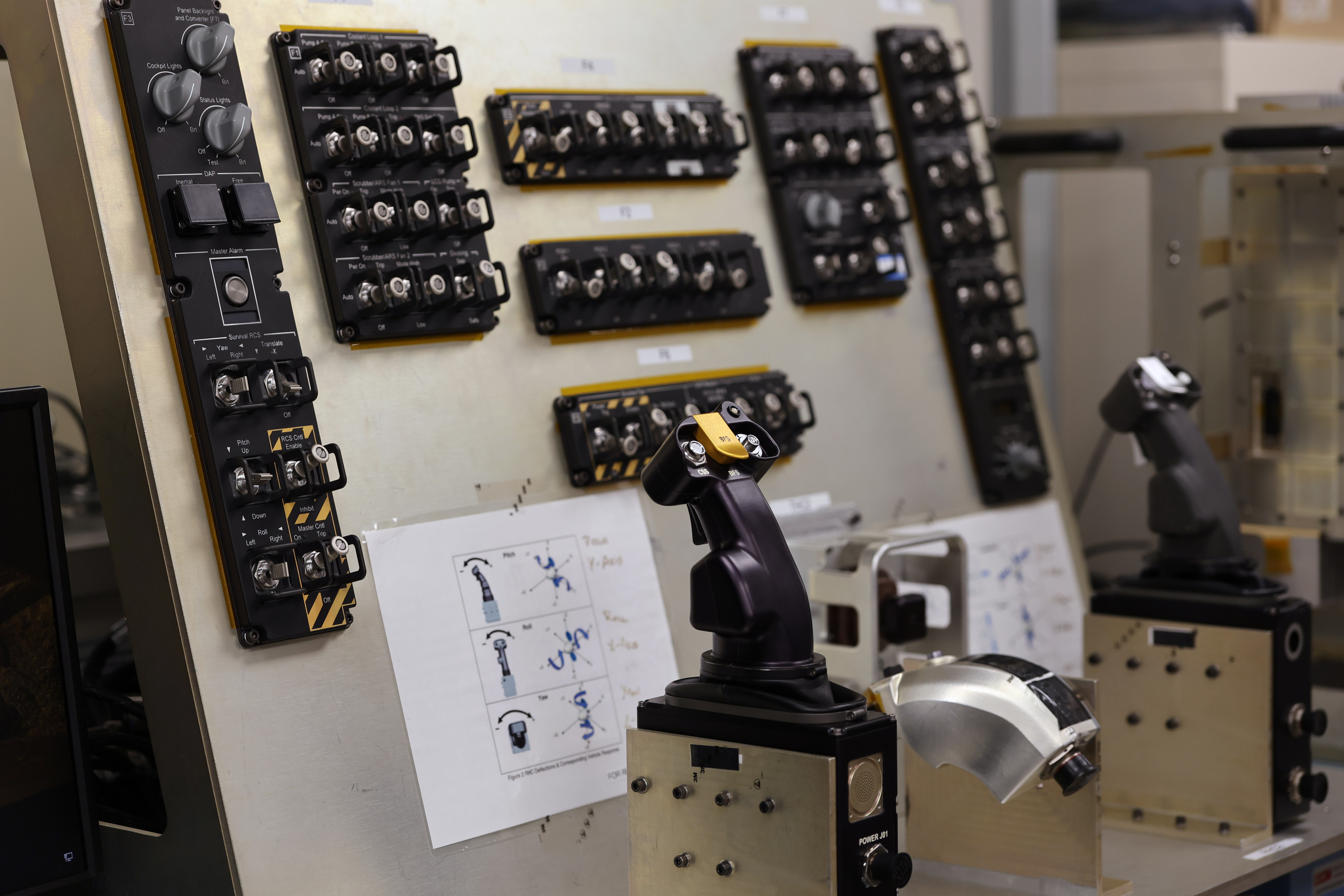 Controls for Orion, including switch interface panels; rotational hand controllers;...