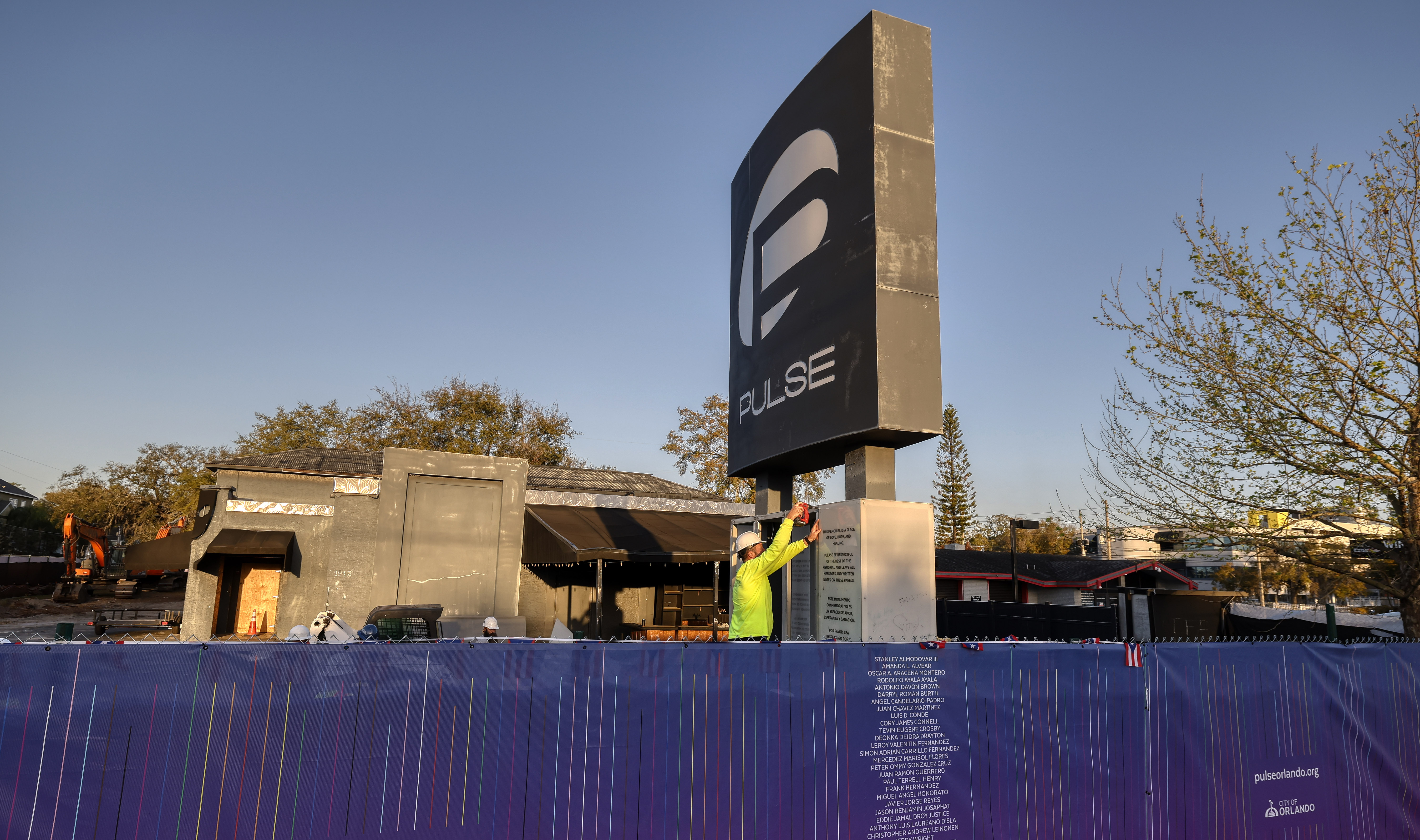 Workers begin the process of taking down the Pulse nightclub...