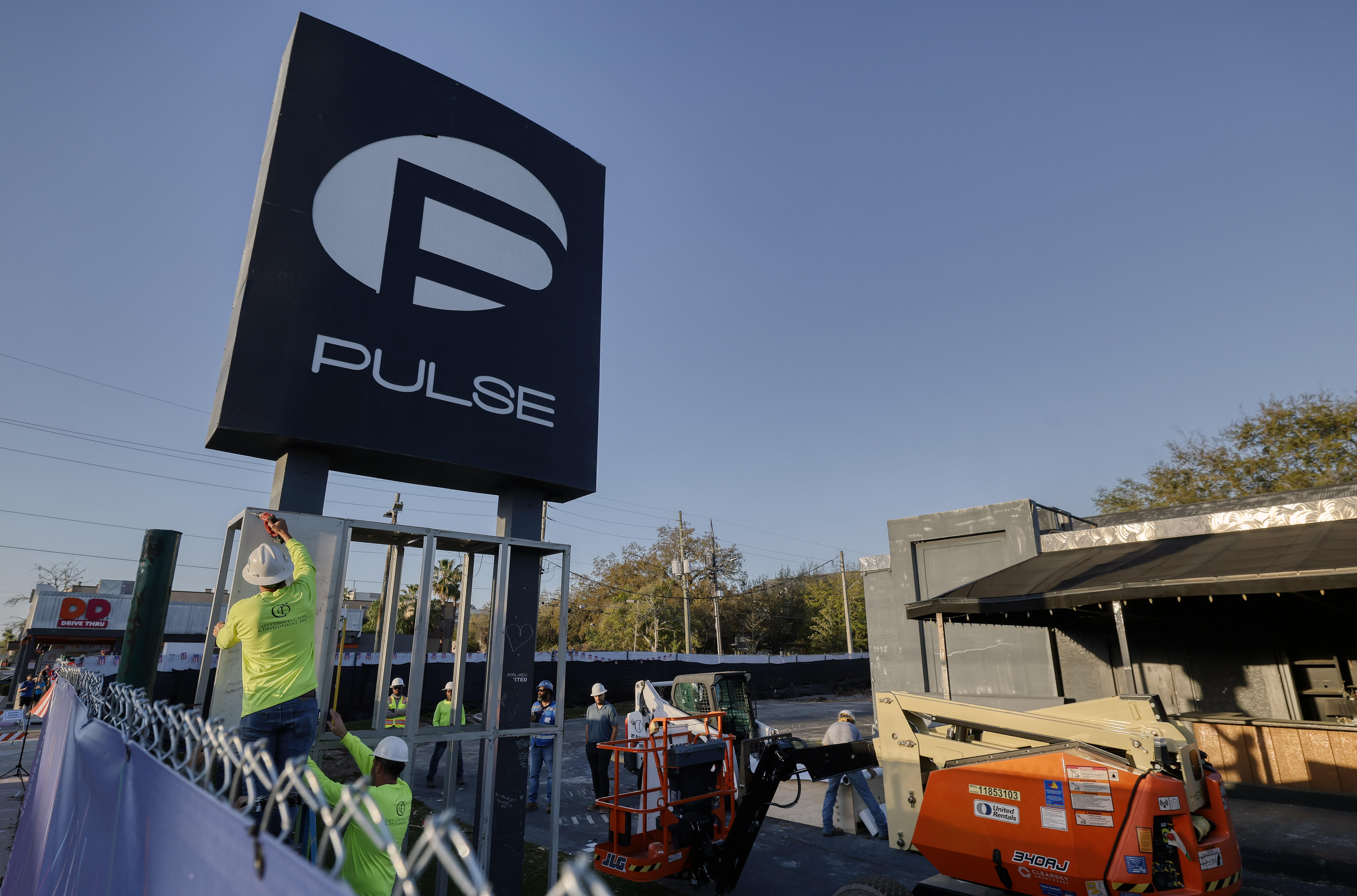 Workers begin the process of taking down the Pulse nightclub...
