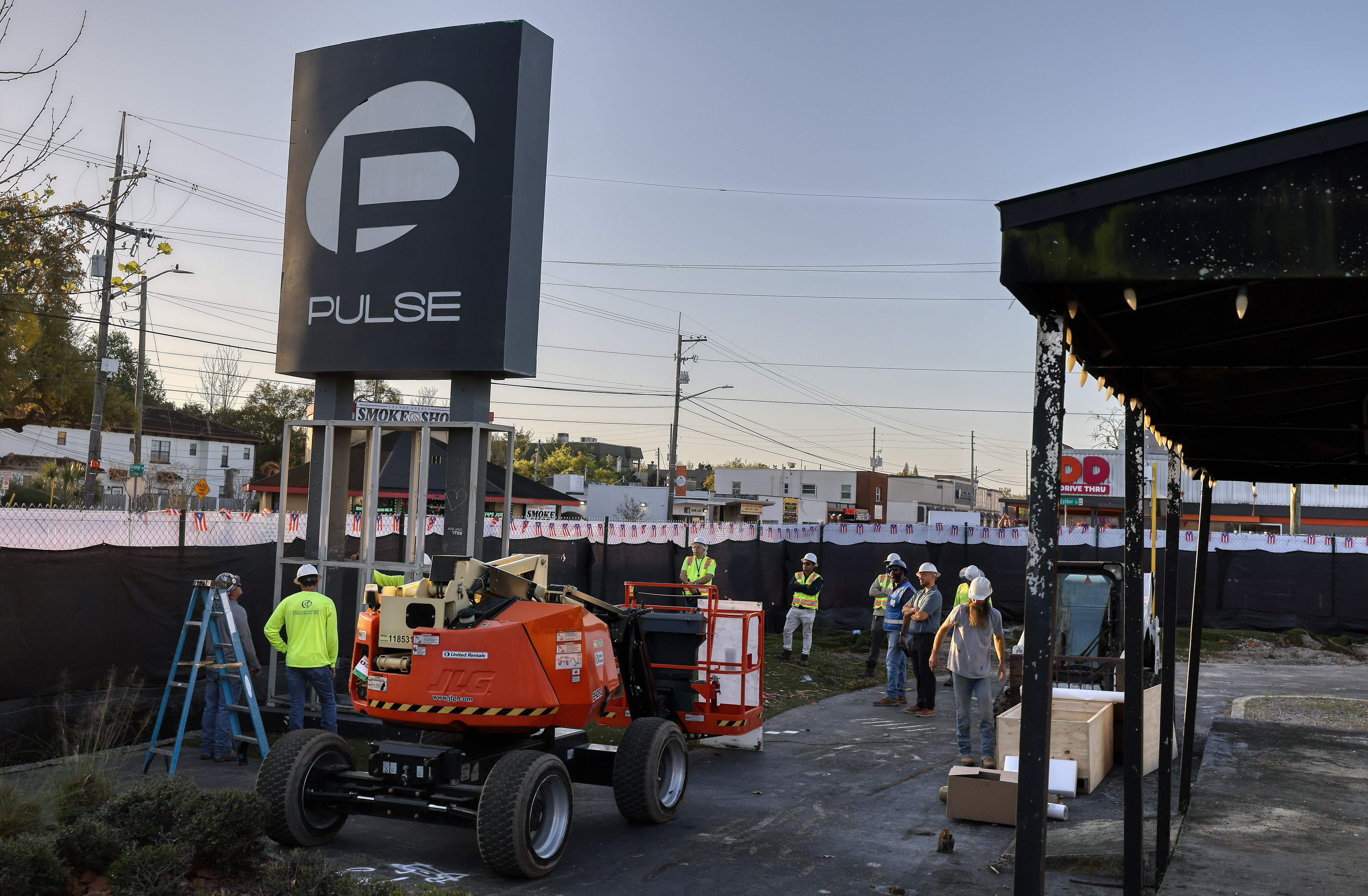 Workers begin the process of taking down the Pulse nightclub...