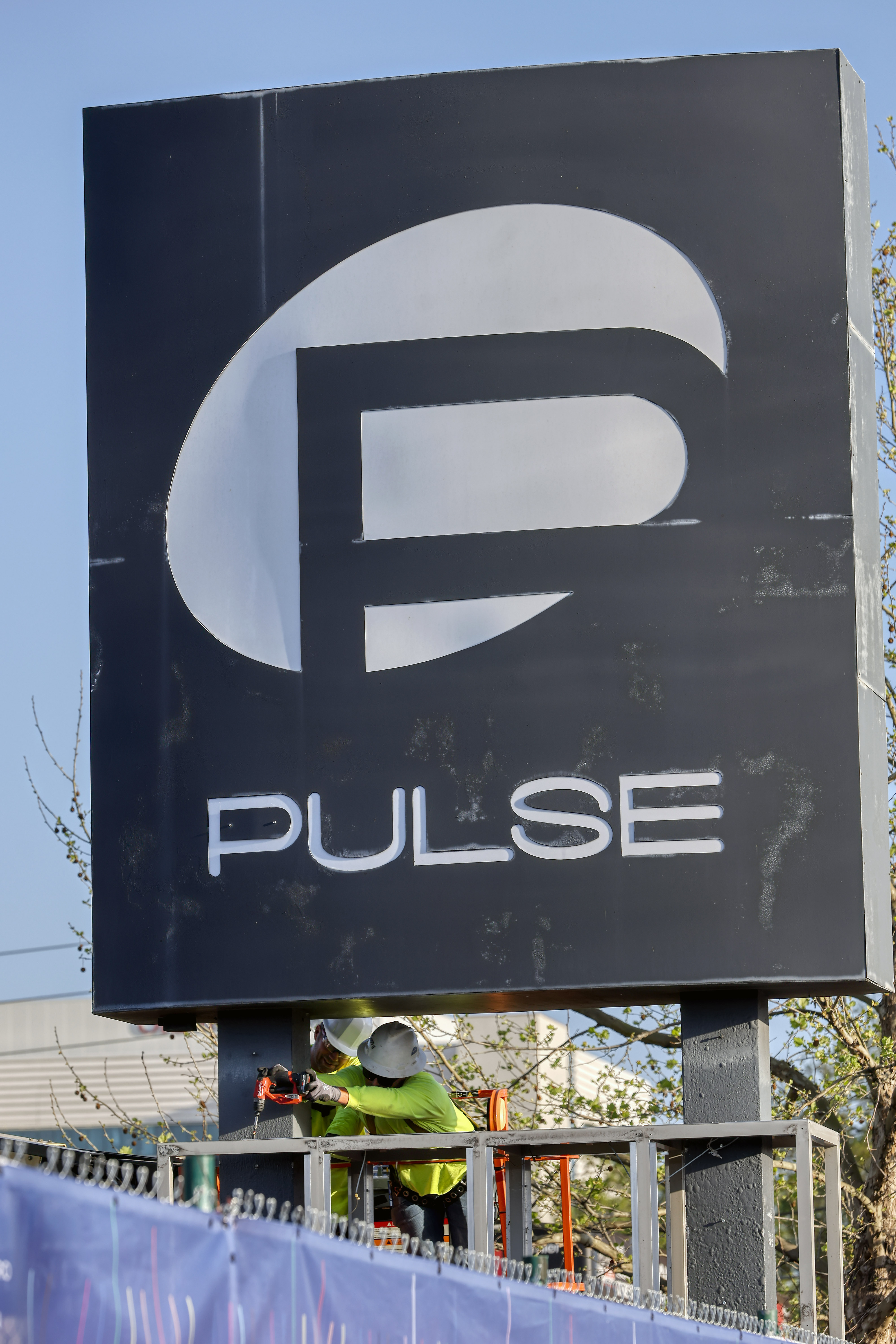 Workers begin the process of taking down the Pulse nightclub...