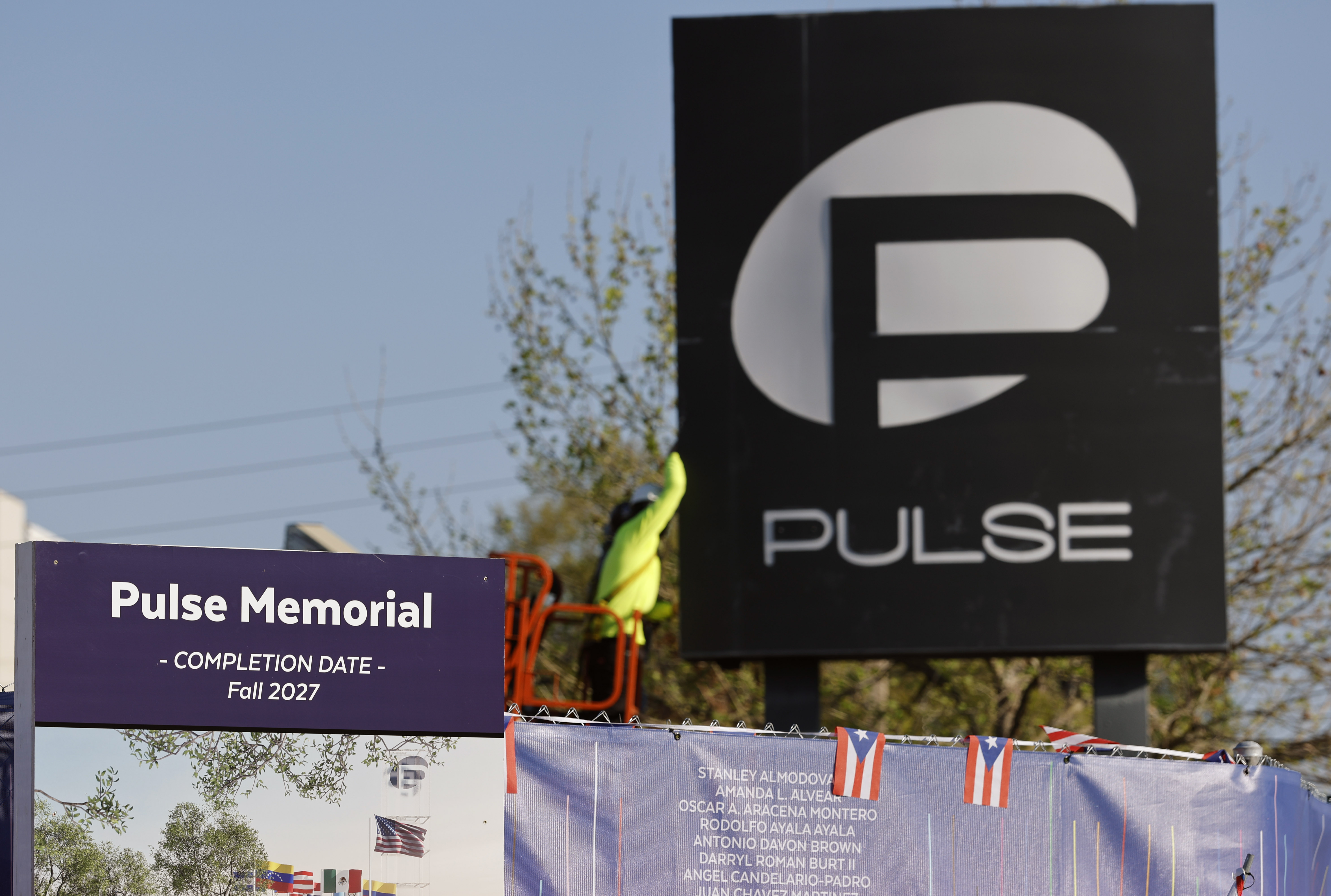 Workers begin the process of taking down the Pulse nightclub...