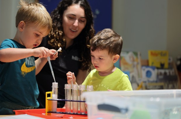 Left to Right, James, assistant teacher Angele O'Callahan and Louis at the Hume House Child Development & Research Center, a preschool housed inside Rollins College's phycology department, on Wednesday, March 4, 2026. (Ricardo Ramirez Buxeda/ Orlando Sentinel)