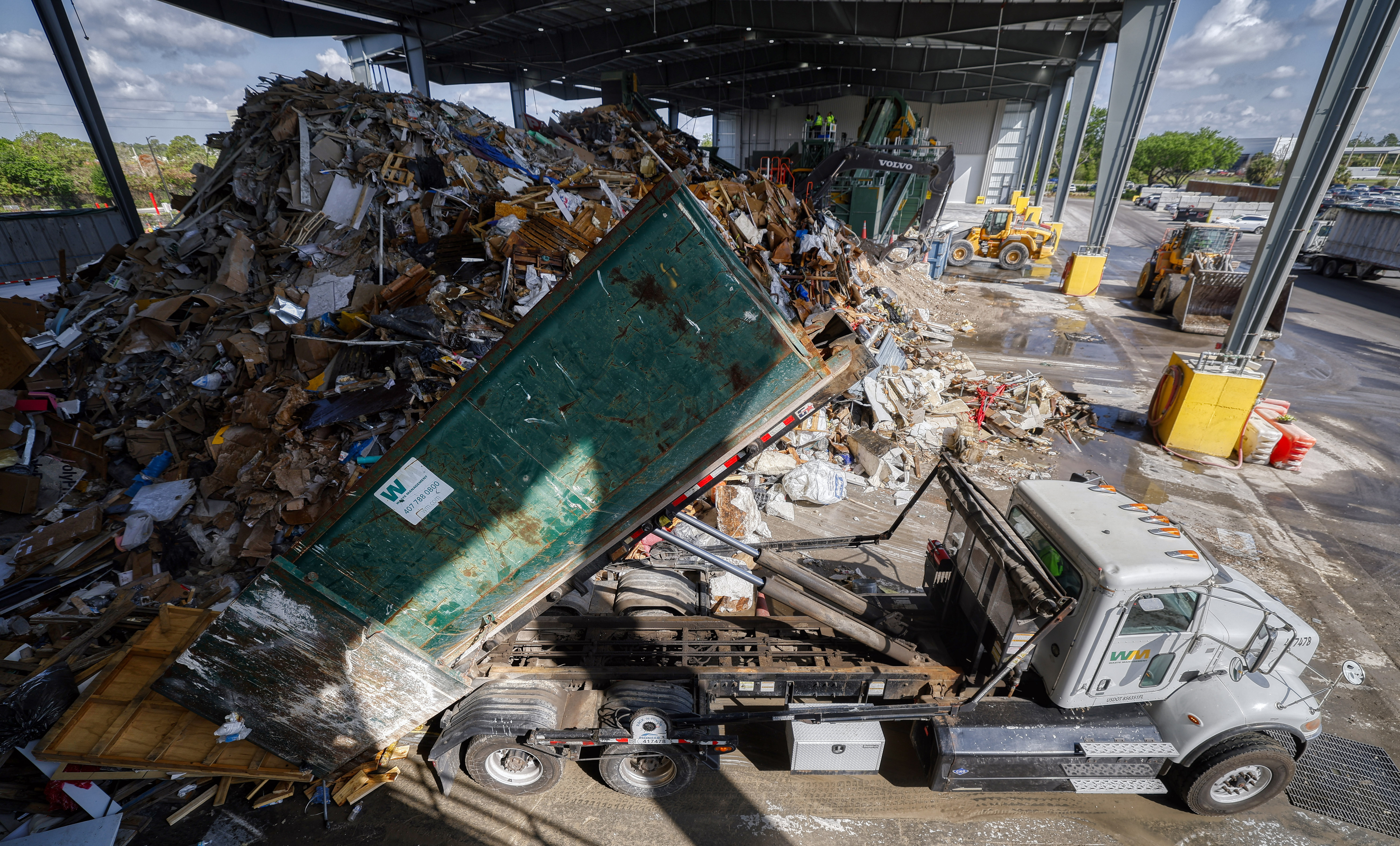A truck adds to the pile during a tour of...