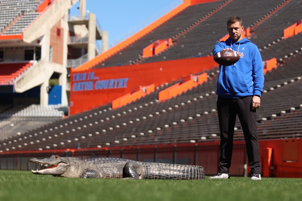 Florida's Jon Sumrall takes a tense photoshoot with a 7-foot alligator
