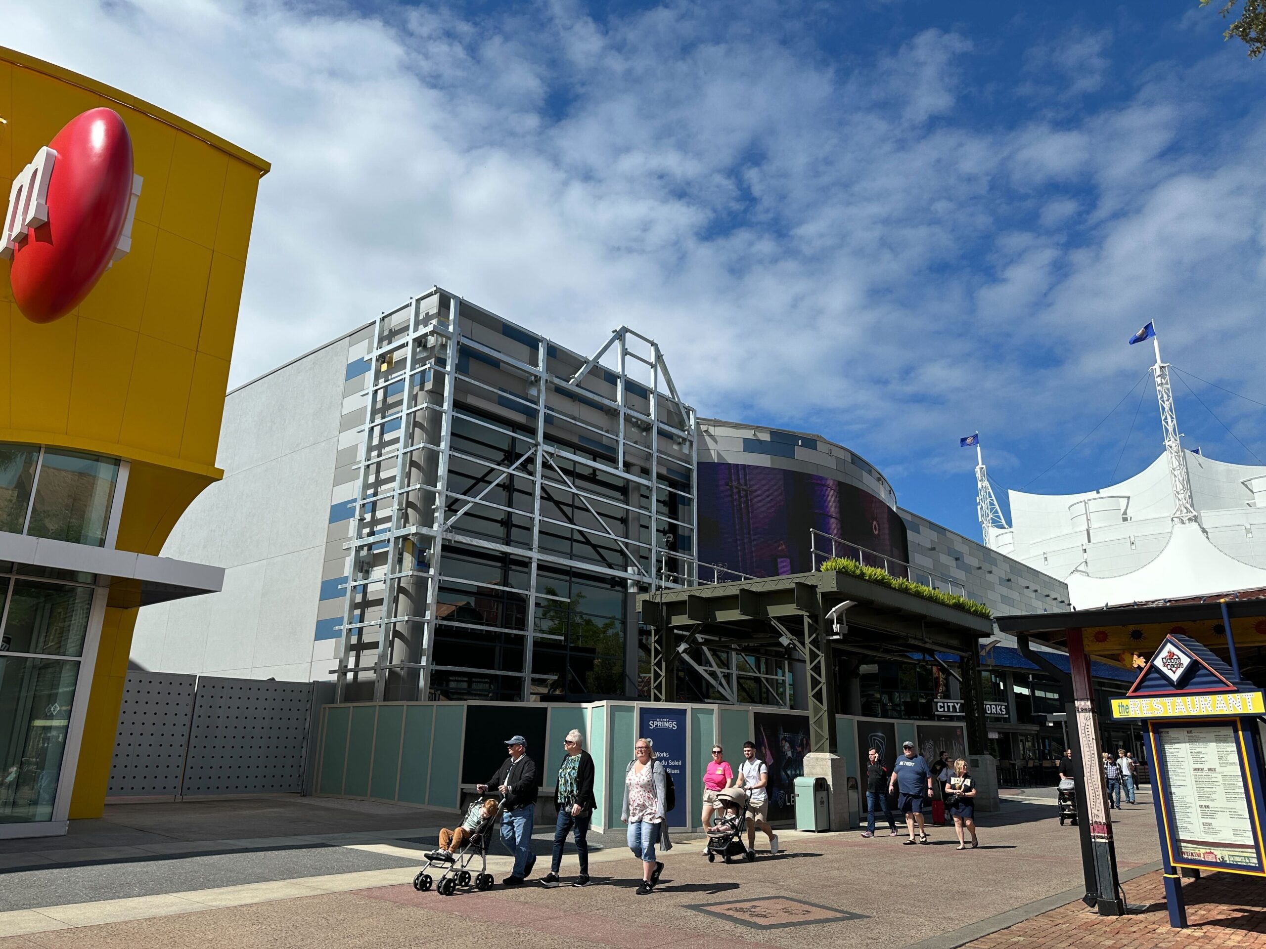 Construction walls and planters continue to block the entrance to Level99. The walls are decorated with concept art for the upcoming location.