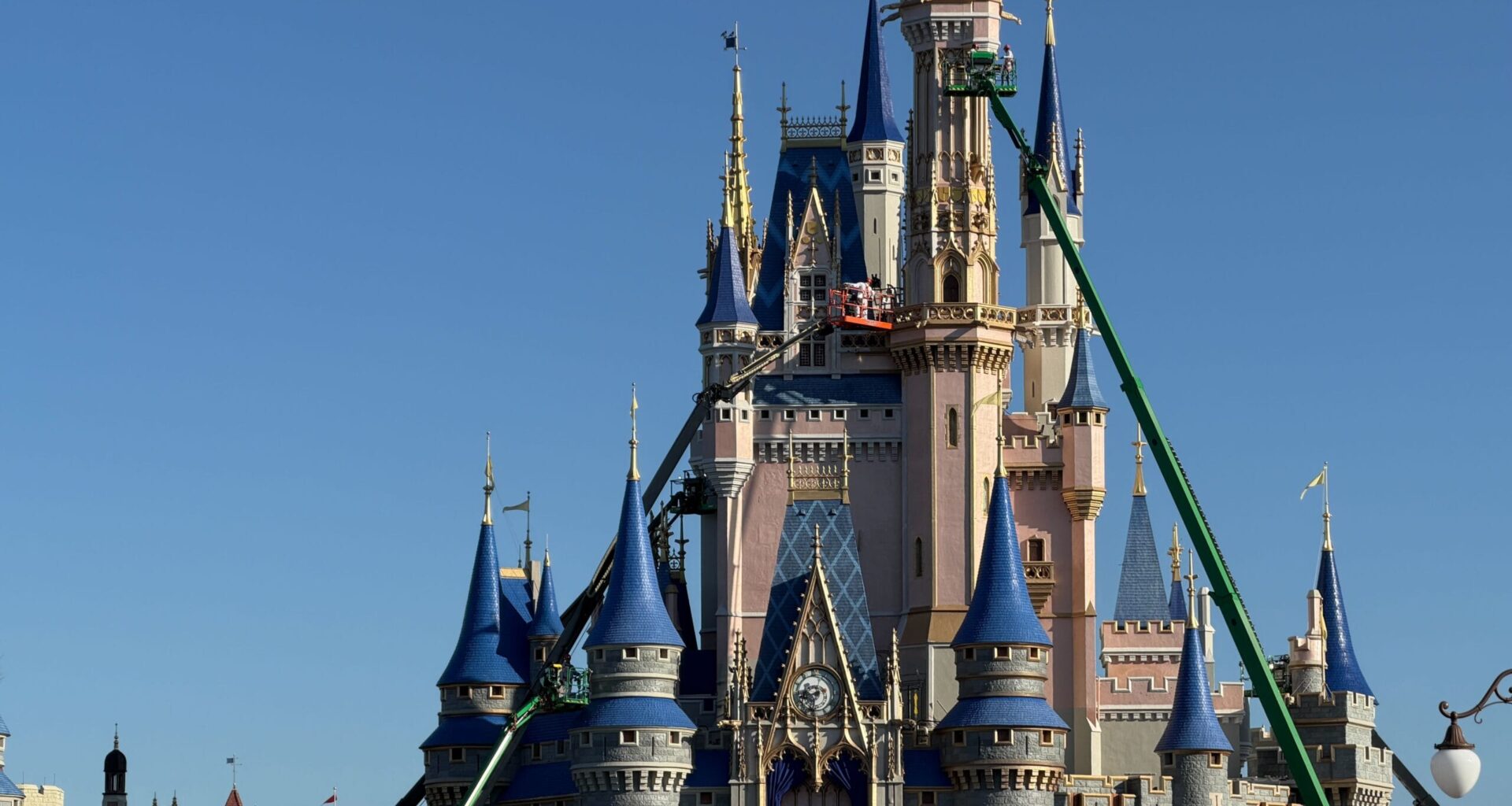 Crews Begin Painting Tallest Tower of Cinderella Castle at Magic Kingdom