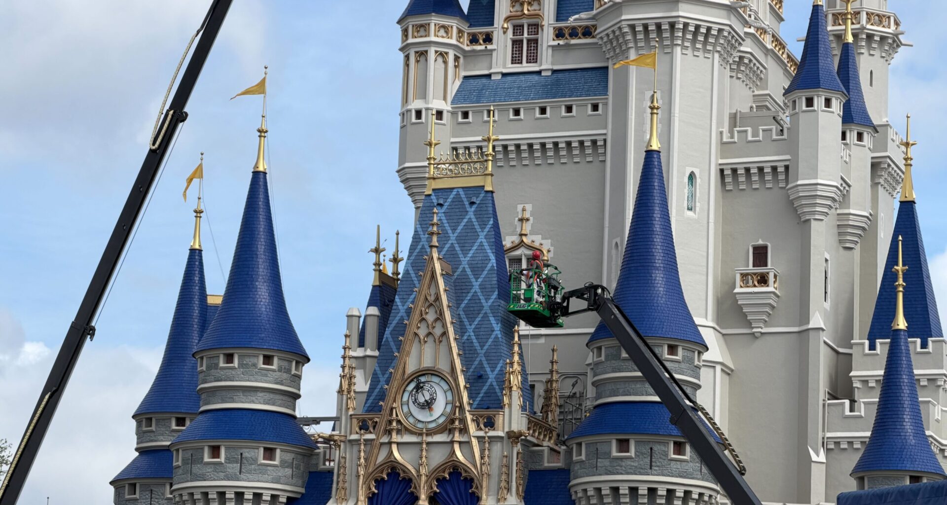 Crews continue to focus on the blue roofing of Cinderella Castle at Magic Kingdom, moving toward the blue towers with the patterns.