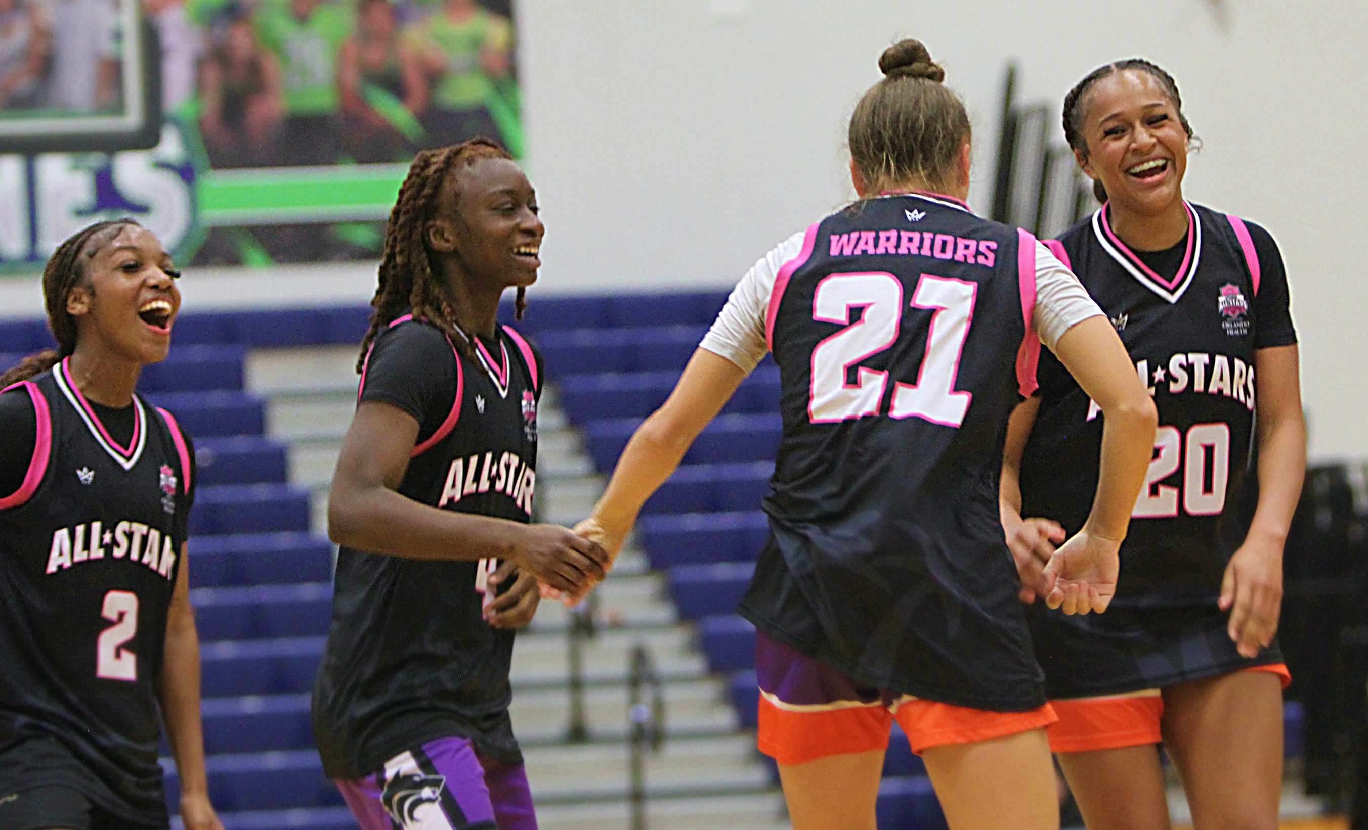 Team Warriors players Dakara Merthie (2) of Ocoee, Laila Allen...