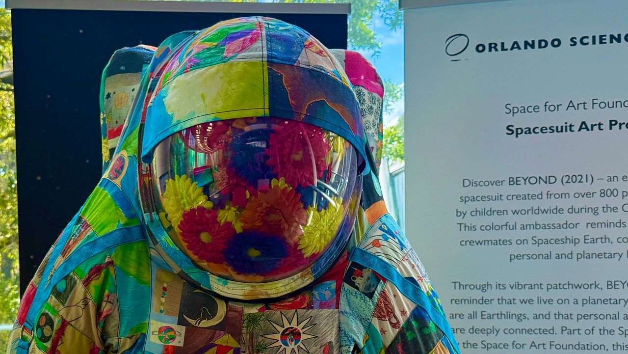Children from around the world contributed to this spacesuit, on display for a few more days at the Orlando Science Center's entrance. (Photo: Allison Walker)