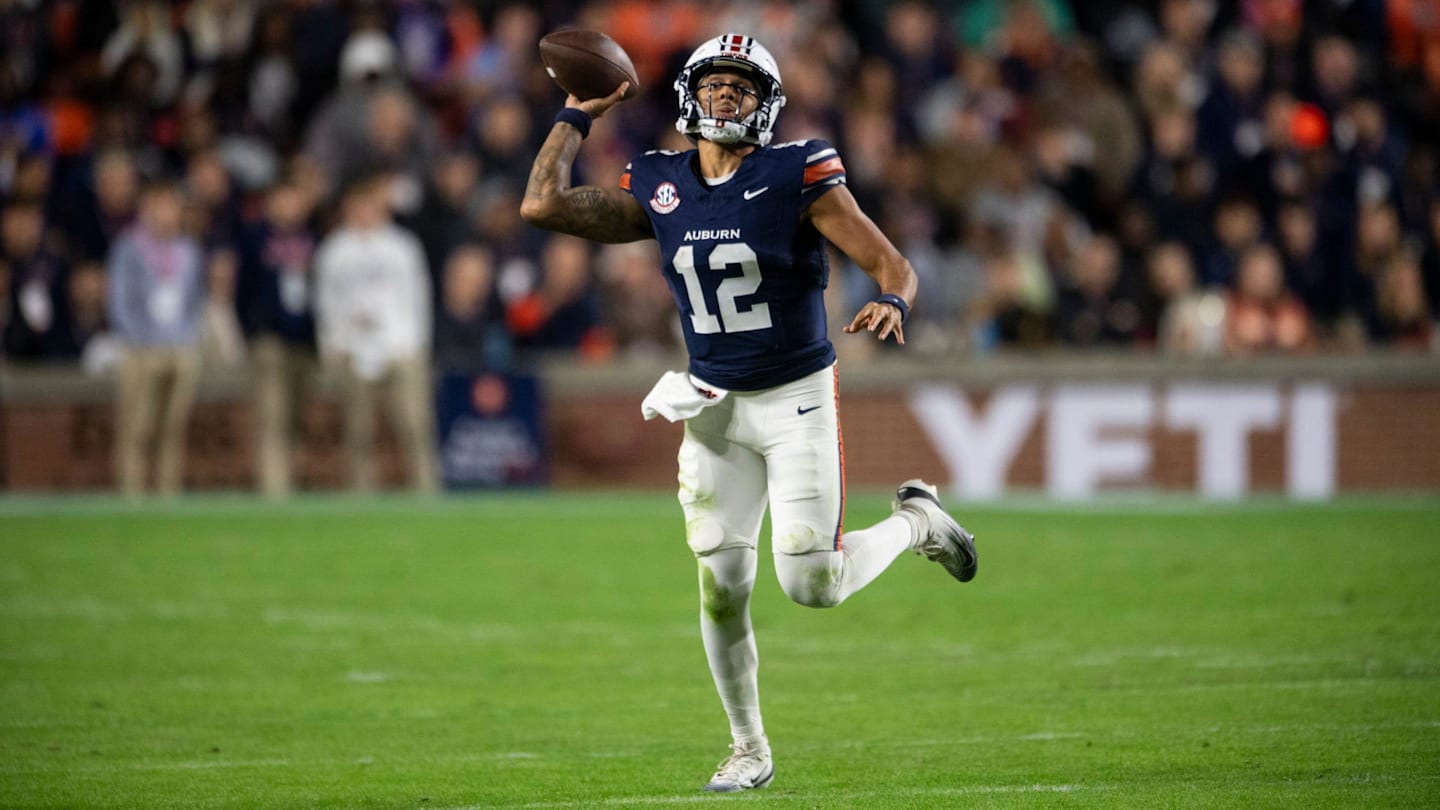 Auburn Tigers quarterback Ashton Daniels (12) pump fakes a pass as Auburn Tigers take on Kentucky Wildcats at Jordan-Hare Stadium in Auburn, Ala. on Saturday, Nov. 1, 2025. Auburn Tigers and Kentucky Wildcats are tied 3-3 at halftime.