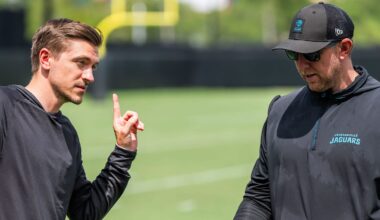 Jacksonville Jaguars general manager James Gladstone, left, talks with Jacksonville Jaguars head coach Liam Coen, right, after the. Jacksonville Jaguars’ mandatory minicamp Tuesday June 10, 2025 at the Miller Electric Center in Jacksonville, Fla.