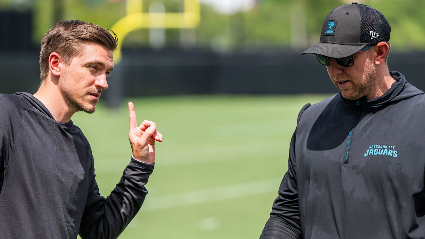 Jacksonville Jaguars general manager James Gladstone, left, talks with Jacksonville Jaguars head coach Liam Coen, right, after the. Jacksonville Jaguars’ mandatory minicamp Tuesday June 10, 2025 at the Miller Electric Center in Jacksonville, Fla.