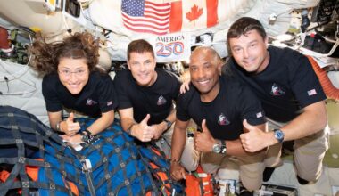 The Artemis II crew mission specialist Christina Koch, left, mission specialist Jeremy Hansen, pilot Victor Glover, and Cmdr. Reid Wiseman gives the thumbs up as they head home back to Earth after doing a flyby mission of the moon. (NASA)