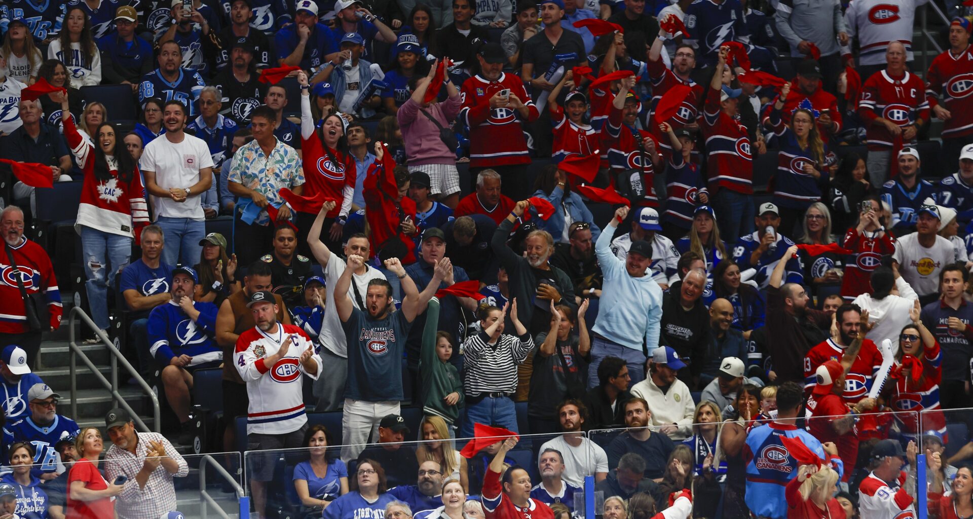 people in habs jerseys celebrate