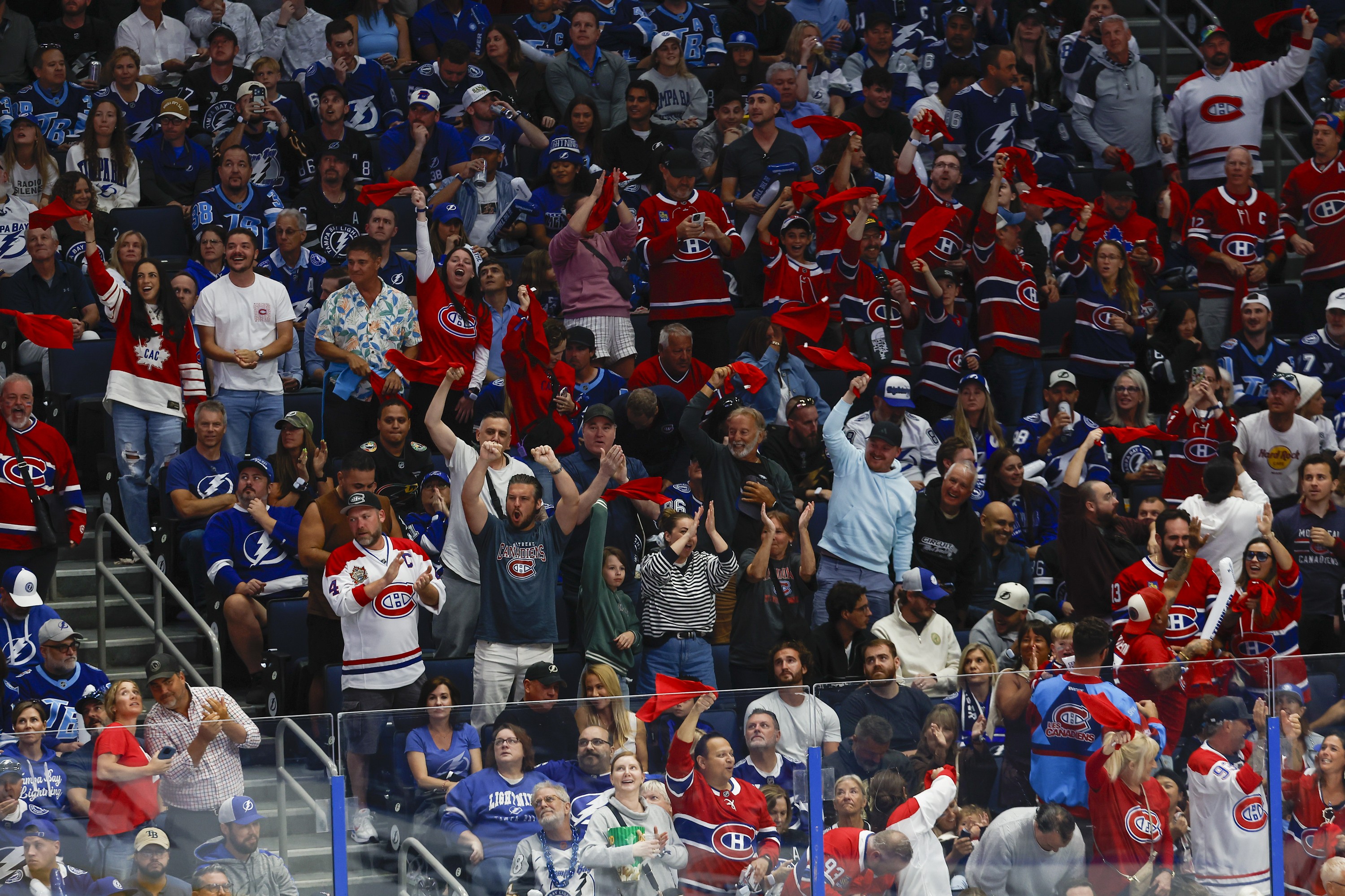 people in habs jerseys celebrate