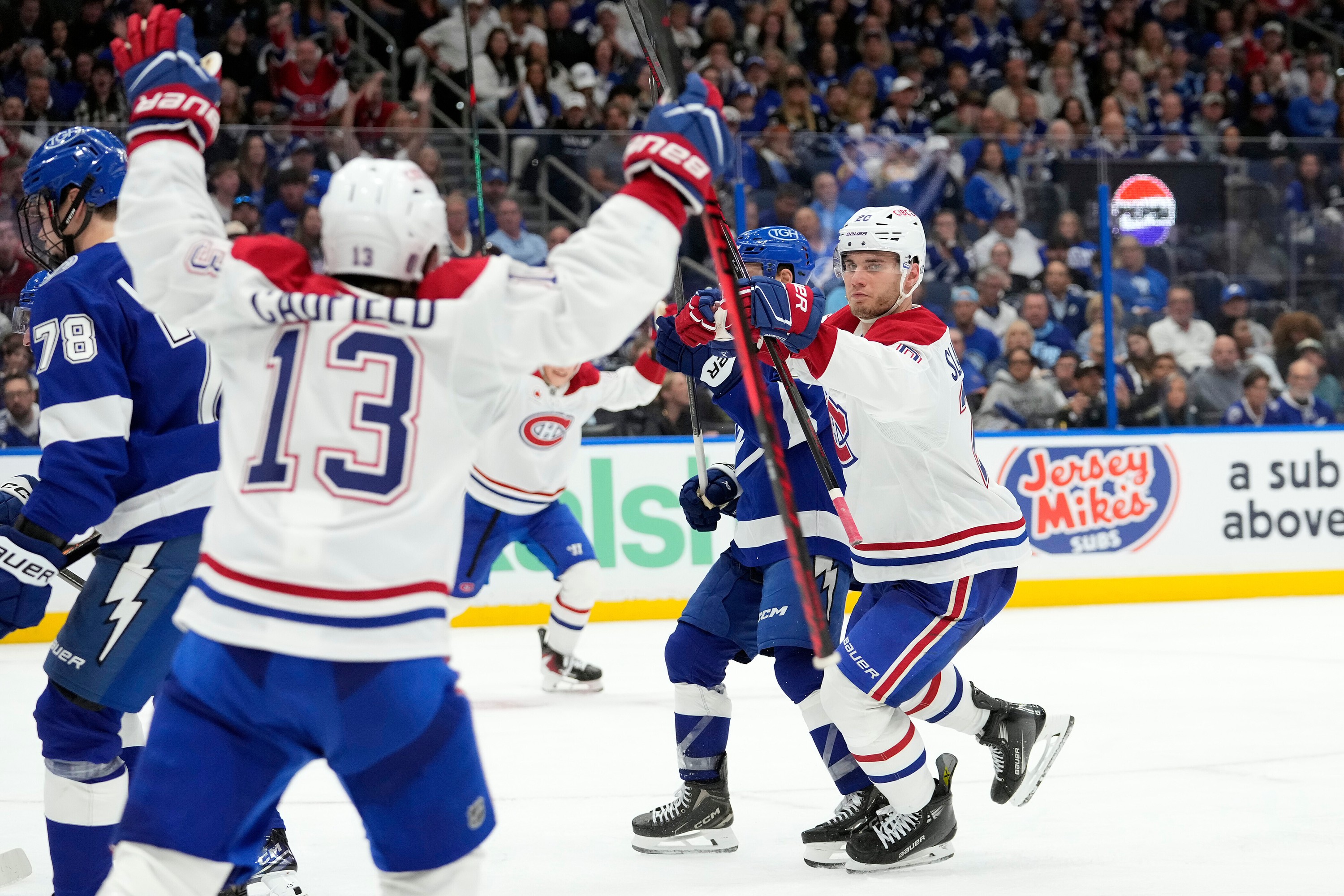 Canadiens' Juraj Slafkovsky and Cole Caufield celebrate Slafkovsky's goal against the Lightning during the third period of Game 1 Sunday in Tampa, Fla.