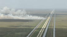 A large brush fire was burning in the Florida Everglades in western Broward County on Tuesday.