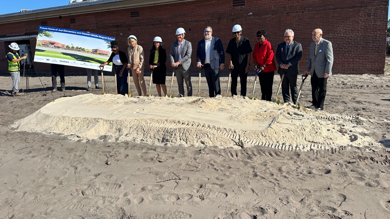 With shovels in hand, Hillsborough School officials kicked off construction on the new shared campus for Just Elementary School and Stewart Middle Magnet. (Spectrum News/Fallon Silcox)