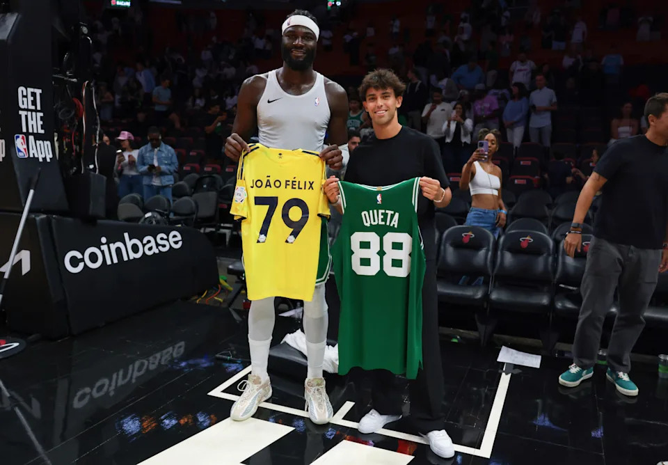 Apr 1, 2026; Miami, Florida, USA; Boston Celtics center Neemias Queta (88) swaps jerseys with Portuguese soccer player Joao Felix after the game against the Miami Heat at Kaseya Center. Mandatory Credit: Sam Navarro-Imagn Images