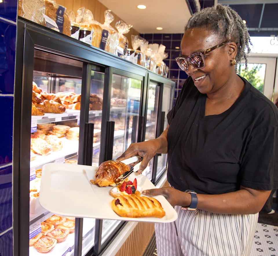 Michele Gibbs picks out her pastries at newly opened Paris Baguette bakery cafe in the St. Johns Town Center.
