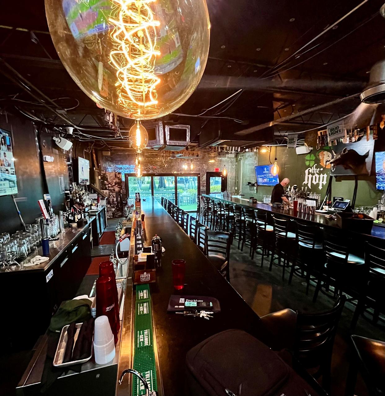 A partner at Cape Coral's long-time, beloved Nevermind Awesome Bar & Eatery faces charges unrelated to the restaurant involving prostitution and racqueteering. Seen here in this file photo, the restaurant has two long Boston-style bars in Cape Coral
