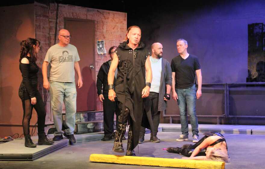 Scene in which Marc Antony (Justin Larsche, center) confronts Brutus and his co-conspirators shortly after their murder of Caesar.