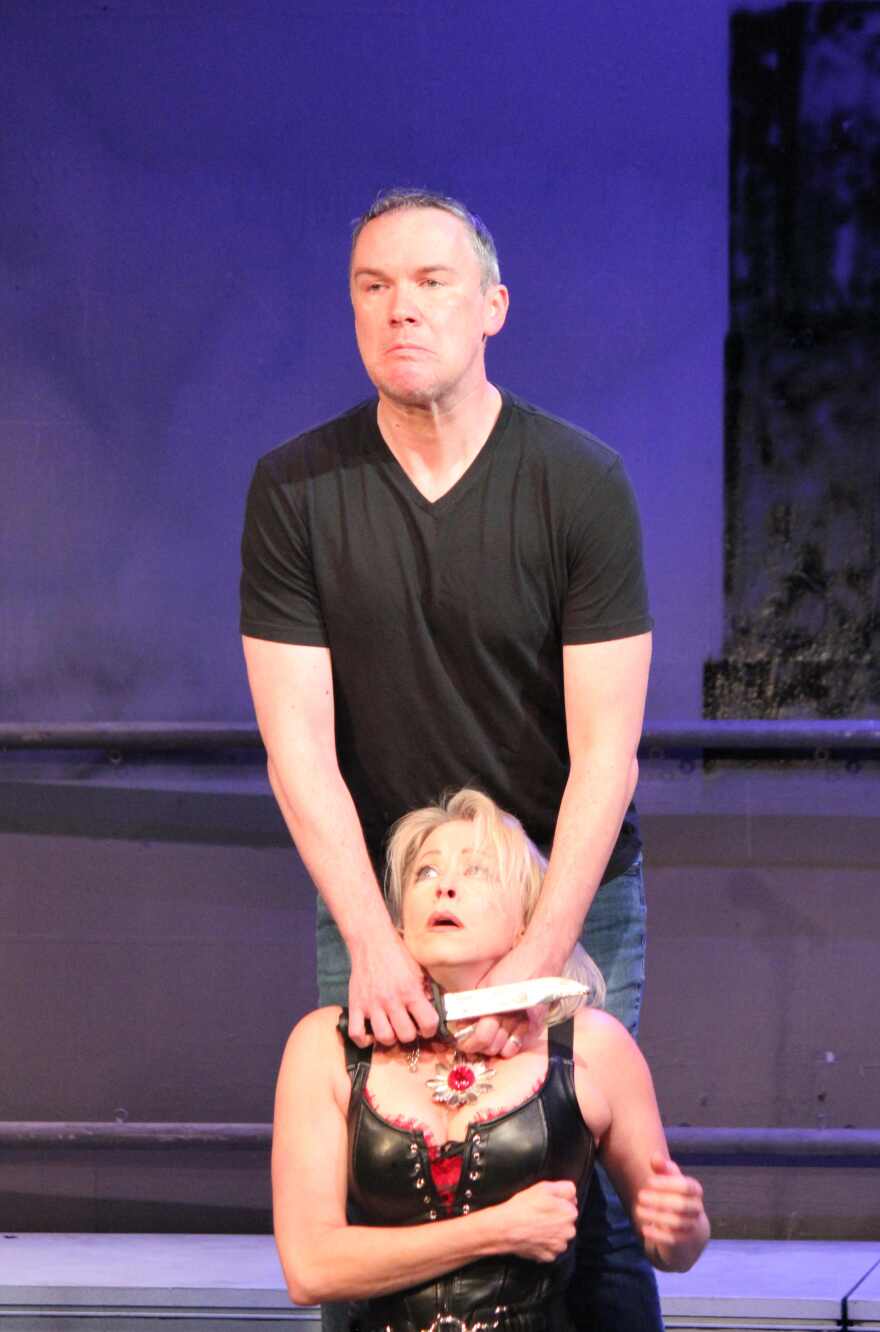 Ryan Adair and Shelley Sanders as Brutus and Julius Caesar in the famous 'et tu Brute' scene during Caesar's assassination.