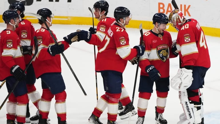 Florida Panthers goaltender Daniil Tarasov (40) is congratulated after the...