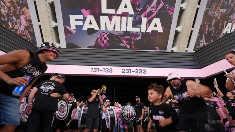 Inter Miami fans dance and play music ahead of the...