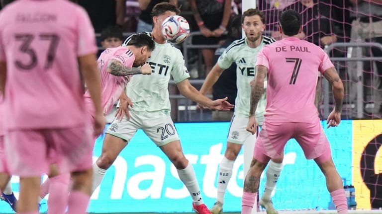 Inter Miami CF forward Lionel Messi, left scores a goal...