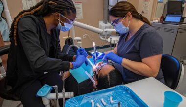 From left, Stephanie Vilfort, a student in the dental assisting program at Cape Coral Technical College practices cleaning skills on classmate Grace Provenzano under the guidance of instructor Chris Weygant Wednesday morning, March 16, 2022. Cape Coral Technical College is planning to expand its curriculum in an effort to bring more blue collar programs to the school.