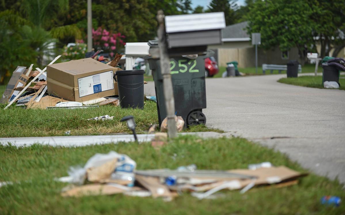 Trash is seen piled up waiting for curbside pickup along the 200 block of Cherry Hill Road in the Windmill Point neighborhood on Wednesday, June 29, 2022, in Port St. Lucie. Both yard debris and trash pickup pile up curbside as Waste Pro continues to be behind in curbside trash and yard waste pickup in Port St. Lucie.